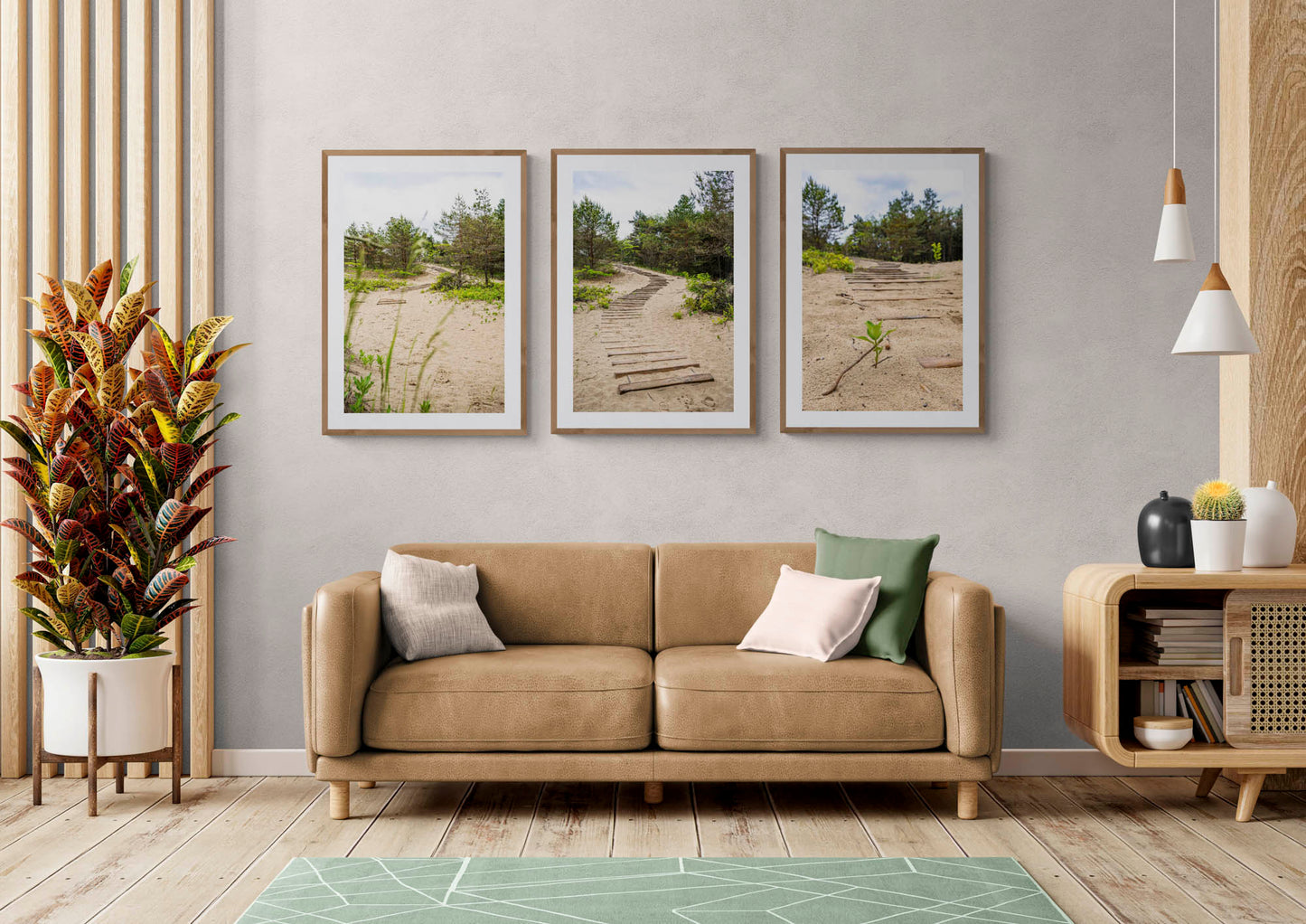 mockup of three hanged path photos above leather couch in living room.