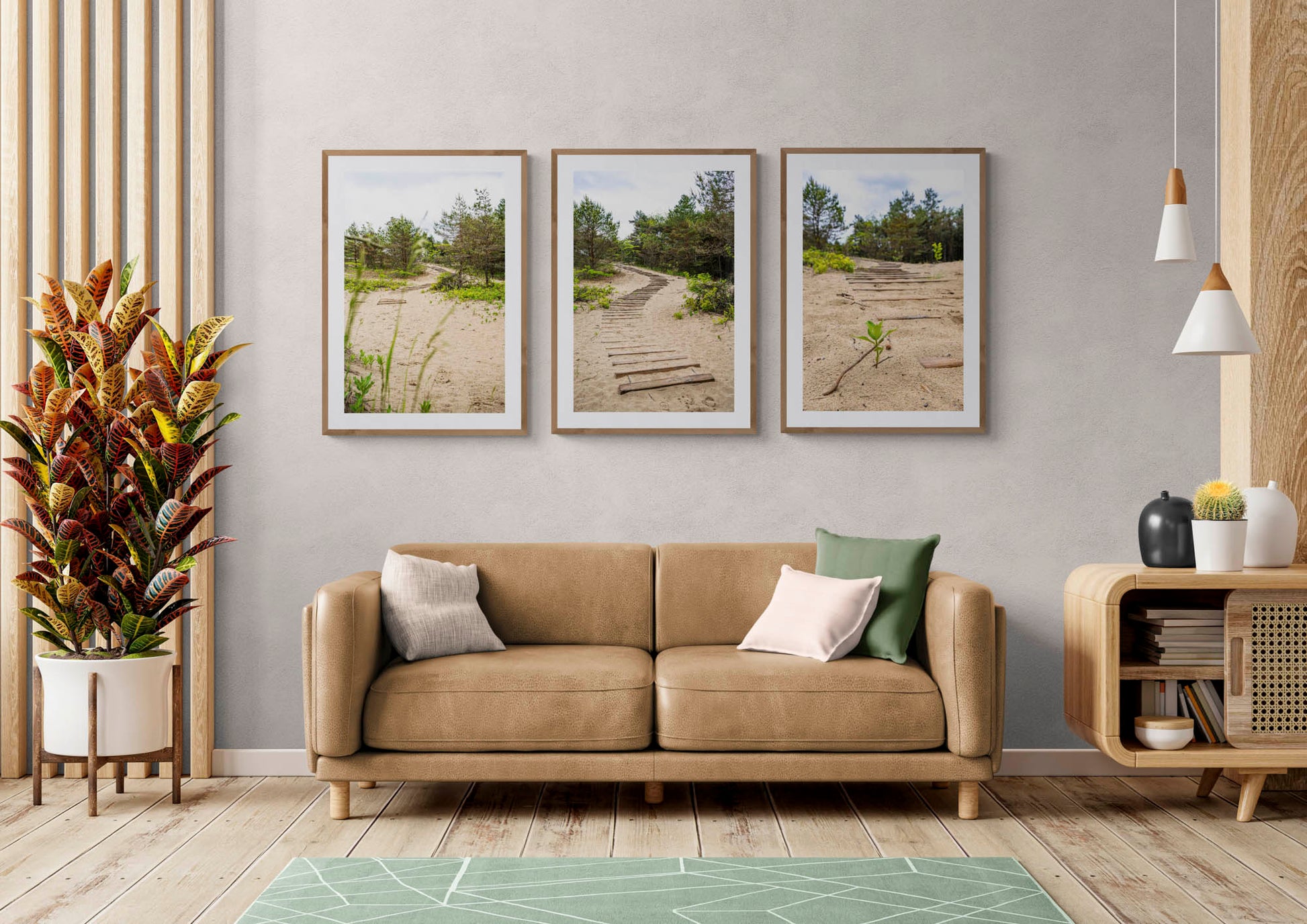 mockup of three hanged path photos above leather couch in living room.